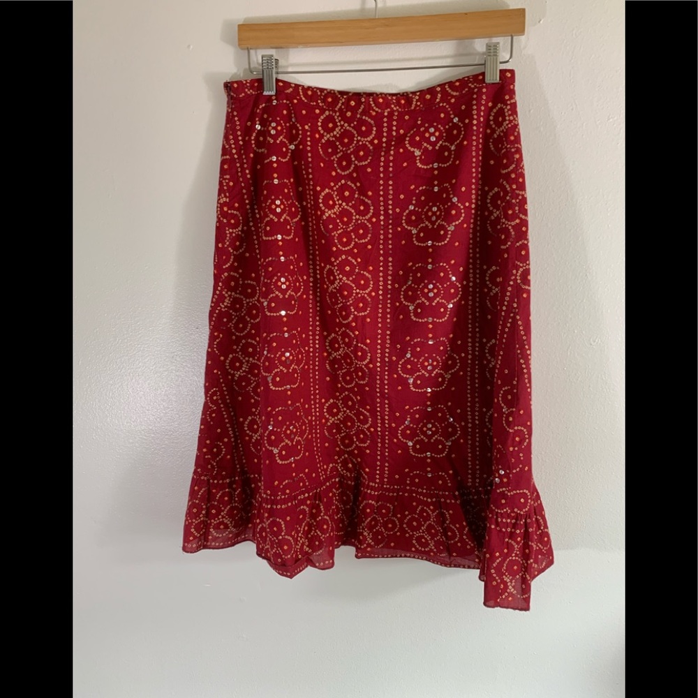 Beautiful,burgundy skirt,with tan design, sequins sewn Sporadically onto skirt.